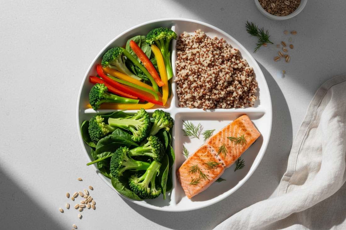 Overhead view of a balanced diabetes plate showing half plate of colorful non-starchy vegetables, one quarter lean protein, and one quarter quality carbohydrates demonstrating the diabetes plate method for blood sugar management